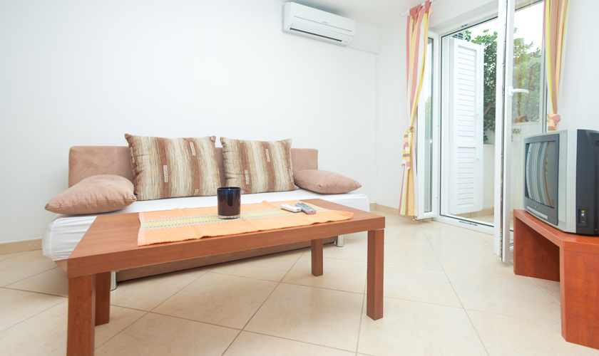 Sofa, coffee table and TV