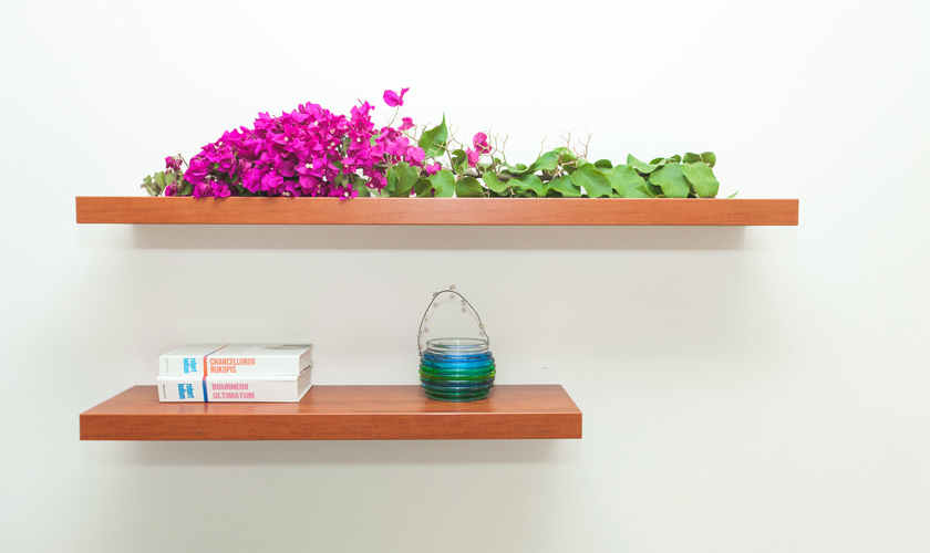 Shelves with flower and candle