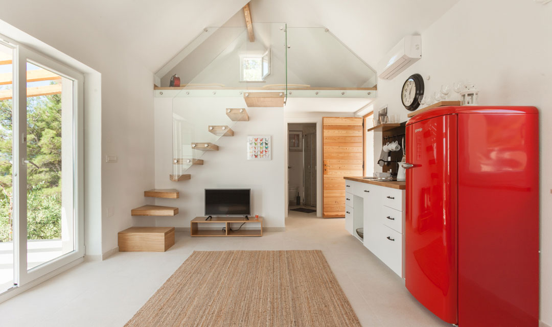 Living room with TV and kitchen